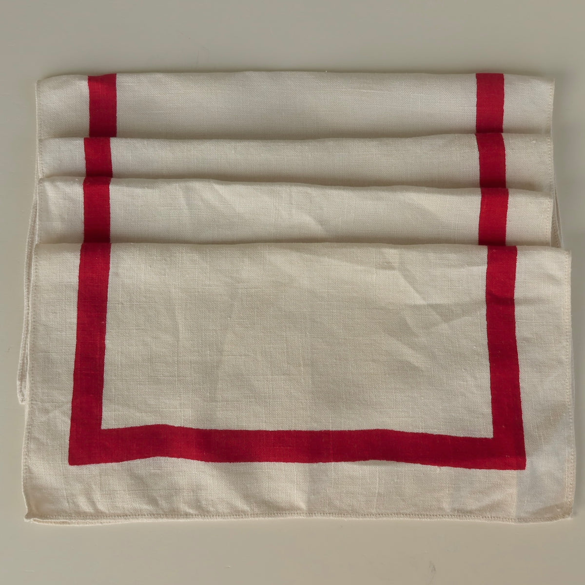 White vintage linen napkins with red script personalization