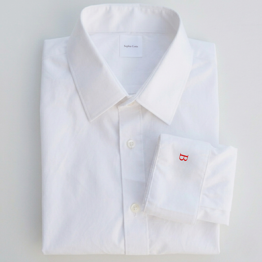White dress shirt with a red letter 'B' on a light gray background